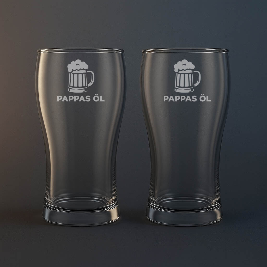 Ölglas med en bild på en öl och texten pappas öl